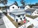 Aerial view of a two-story house with gray roof and gray driveway at 2404 1/2 E Chelsea, Tampa, FL 33610