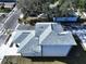 Aerial view of a new two-story house with a gray shingle roof and white exterior at 2404 1/2 E Chelsea, Tampa, FL 33610