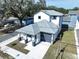 Aerial view of a two-story house with gray roof and front yard at 2404 1/2 E Chelsea, Tampa, FL 33610