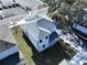 New construction home, aerial view showcasing the gray roof and backyard at 2404 1/2 E Chelsea, Tampa, FL 33610