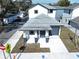 Aerial view of a house with gray roof, two-toned exterior and driveway at 2404 1/2 E Chelsea, Tampa, FL 33610