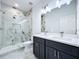 Modern bathroom with double vanity and glass shower at 2404 1/2 E Chelsea, Tampa, FL 33610