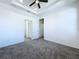 Spacious bedroom with carpeted floor and ceiling fan at 2404 1/2 E Chelsea, Tampa, FL 33610