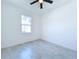 Bright bedroom with ceiling fan and tile flooring at 2404 1/2 E Chelsea, Tampa, FL 33610