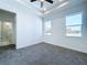 Bright bedroom with carpet and en-suite bathroom at 2404 1/2 E Chelsea, Tampa, FL 33610