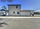 Side view of house showing the garage and windows at 2404 1/2 E Chelsea, Tampa, FL 33610