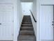 Gray carpeted stairs leading to the second floor at 2404 1/2 E Chelsea, Tampa, FL 33610