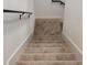 Carpeted staircase with dark metal railing at 2404 1/2 E Chelsea, Tampa, FL 33610