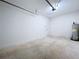 Unfinished garage with garage door opener and extra space at 2404 E Chelsea, Tampa, FL 33610