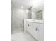 Bathroom features a glass shower, modern vanity, and marble accents at 2911 E 20Th Ave, Tampa, FL 33605