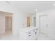 Modern kitchen island featuring white marble countertops and black hardware at 3910 E Genesee St, Tampa, FL 33610