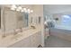 Bathroom with a vanity, a large mirror, and access to the bedroom at 6211 Sun Blvd # 601, St Petersburg, FL 33715