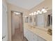 Double vanity bathroom with updated fixtures and walk-in shower at 6211 Sun Blvd # 601, St Petersburg, FL 33715