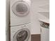 Convenient laundry room with washer, dryer, and extra shelving at 6211 Sun Blvd # 601, St Petersburg, FL 33715