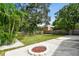 Large backyard with fire pit and lush landscaping at 4607 W San Jose St, Tampa, FL 33629