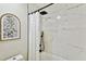 Updated bathroom with marble shower and white accents at 4607 W San Jose St, Tampa, FL 33629