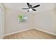 Simple bedroom with ceiling fan and hardwood flooring at 4607 W San Jose St, Tampa, FL 33629