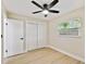 Bright bedroom with a ceiling fan and double door closet at 4607 W San Jose St, Tampa, FL 33629