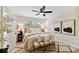 Spacious bedroom with a ceiling fan, neutral walls and hardwood flooring at 4607 W San Jose St, Tampa, FL 33629