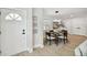 Modern dining room with glass table and four chairs at 4607 W San Jose St, Tampa, FL 33629