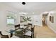 Modern dining room with glass table and contemporary lighting at 4607 W San Jose St, Tampa, FL 33629