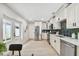 Modern kitchen featuring stainless steel appliances and white cabinets at 4607 W San Jose St, Tampa, FL 33629