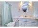 Clean bathroom with shower/tub combo and white vanity at 7141 El Matador St, Zephyrhills, FL 33541