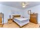 Bright bedroom with wooden furniture and ceiling fan at 7141 El Matador St, Zephyrhills, FL 33541