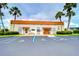 Community building with palm trees and parking at 7141 El Matador St, Zephyrhills, FL 33541