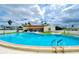 Inviting kidney-shaped community pool at 7141 El Matador St, Zephyrhills, FL 33541