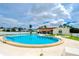 Community swimming pool with surrounding lounge area at 7141 El Matador St, Zephyrhills, FL 33541