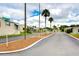 Residential street view with palm trees and mobile homes at 7141 El Matador St, Zephyrhills, FL 33541