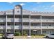 Two-story building exterior with balconies and parking at 2295 Americus E Blvd # 27, Clearwater, FL 33763