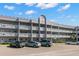 Building exterior showcasing multiple units and parking at 2295 Americus E Blvd # 27, Clearwater, FL 33763