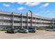 Two-story building exterior with balconies and parking at 2295 Americus E Blvd # 27, Clearwater, FL 33763