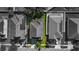 Aerial view of a single-Gathering home with a gray roof and a green lawn at 3147 Calvano Dr, Land O Lakes, FL 34639