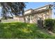 Large backyard with unkempt grass and AC unit at 3147 Calvano Dr, Land O Lakes, FL 34639