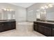 Large bathroom with double vanities, soaking tub and shower at 3147 Calvano Dr, Land O Lakes, FL 34639