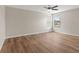 Bright bedroom featuring wood-look floors and a window at 3147 Calvano Dr, Land O Lakes, FL 34639