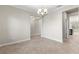Dining room with tile flooring, neutral walls, and access to kitchen at 3147 Calvano Dr, Land O Lakes, FL 34639