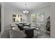 Dining room with a modern table and chairs, and light walls at 3147 Calvano Dr, Land O Lakes, FL 34639
