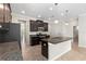 Kitchen with island, granite countertops, stainless steel appliances and dark cabinets at 3147 Calvano Dr, Land O Lakes, FL 34639