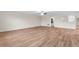 Large living room with wood-look floors and ceiling fan at 3147 Calvano Dr, Land O Lakes, FL 34639