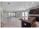 Open floor plan showcasing living room and kitchen at 3147 Calvano Dr, Land O Lakes, FL 34639