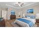 Spacious main bedroom with wood floors and ensuite bathroom at 3147 Calvano Dr, Land O Lakes, FL 34639