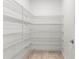 Walk-in pantry with ample shelving for storage at 3147 Calvano Dr, Land O Lakes, FL 34639