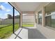 Spacious screened porch with concrete flooring at 3147 Calvano Dr, Land O Lakes, FL 34639