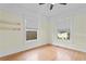 Bright bedroom with hardwood floors and window coverings at 5700 N Suwanee Ave, Tampa, FL 33604