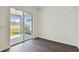 View of backyard through sliding glass doors from kitchen at 1686 Fallon Pass, Zephyrhills, FL 33541