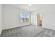 Spacious bedroom with large windows and en-suite bathroom at 1686 Fallon Pass, Zephyrhills, FL 33541